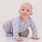 Baby in a checkered outfit on a white background